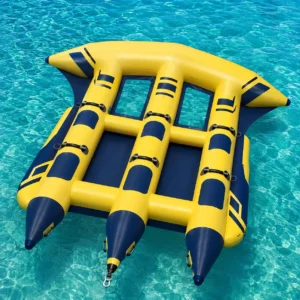 Yellow and navy three person inflatable flying fish towable tube with wing shape, handles and tow point floating on clear blue water